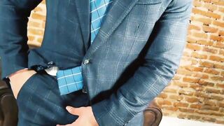 Suited Little Brako rubbed his while after stroking his long thick cock