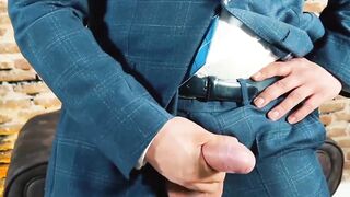 Suited Little Brako rubbed his while after stroking his long thick cock