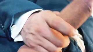 Suited Little Brako rubbed his while after stroking his long thick cock