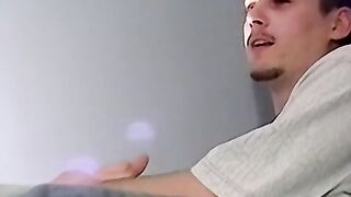 A bald black dude with a massive cock rubbing it til he cums