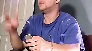 A bald black dude with a massive cock rubbing it til he cums