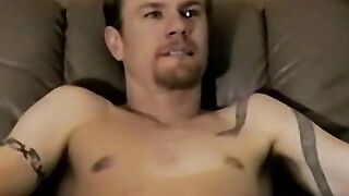 Handsome young model shoots hot cum on a towel