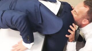 Suited Bastian Karim bent over for an ass drilling by hot Vadim Romanov