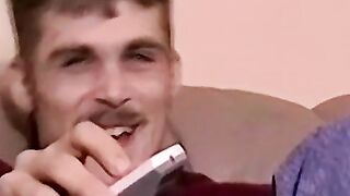 Moustached guy jerks off in his comfy couch