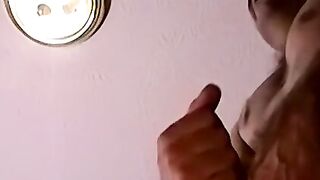 Moustached guy jerks off in his comfy couch