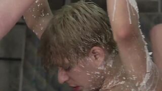 Blond young dude cleaned by two guys while he is tied up