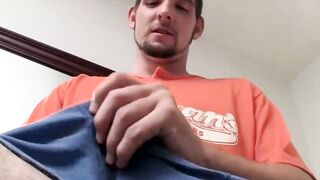 Handsome Tim pumping a squirting cum load from his helmet