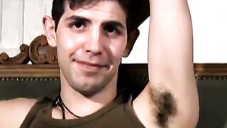 Slim twink tugs on his throbbing dick in this classic video