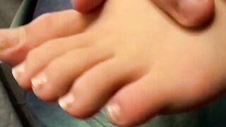 Novice twink Aaron Slater showing off his sexy feet while stroking his cock