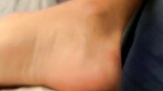 Novice twink Aaron Slater showing off his sexy feet while stroking his cock