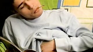 Young Marivelli hops on the couch and starts his smoking and jerking session