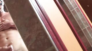 Fit stud hides his identity while stroking his enormous dick