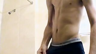 Sexy Bleu is blowing smoke and stroking his cock in the while taking a shower