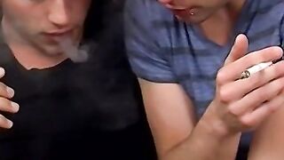 Two handsome twinks mess around the couch while smoking