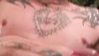 Seductive tattooed hunk jerks off while moaning in hot solo