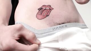 Naughty Sean Johansen reveals his new tattoo before stroking his hard cock