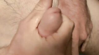 Handsome deviant pees over himself before masturbating solo