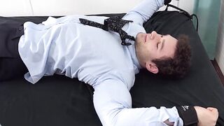 Handsome Zak was locked up and wiggled in an intense tickle  by a master