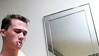 Cute chainsmoker stroke his cock as he blows smoke clouds