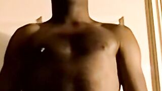 Black amateur strips and masturbates into an intense orgasm