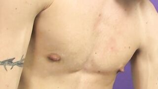 Tattooed skinny twink Ryan sprays cum after dick stroking