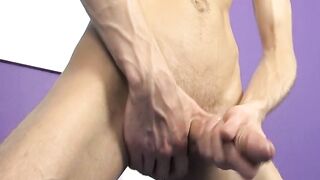 Tattooed skinny twink Ryan sprays cum after dick stroking
