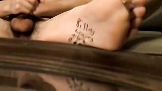 Hot inked dudes Axel and Billy da Kidd play with their feet and massive cock