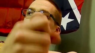Skinny amateur twink with glasses spanks his cock and cums