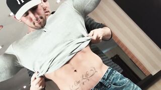 Stud strokes his dick while another man is touching him