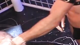 Hunky homosexual in his jockstrap endures having his ass fist fucked by his buddy who