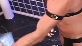 Hunky homosexual in his jockstrap endures having his ass fist fucked by his buddy who