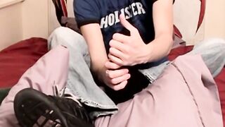 A gorgeous young guy with big feet and a juicy cock drains his cum load