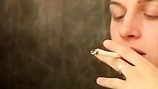 Alluring lover spreads his ass while he smokes a cigar