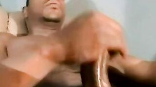 Hunky black dude jerks off and cums while sucked by old man