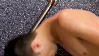 Gorgeous lad gets naked in the shower and rides a wall dildo