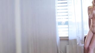 Blonde big titted Erin K plays with pearls and then worships her sultry body