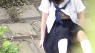 Cute Japanese schoolgirl rubs her trimmed pussy in public
