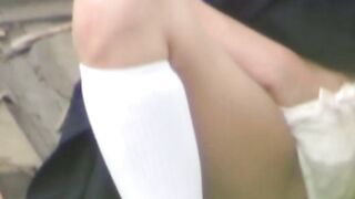 Cute Japanese schoolgirl rubs her trimmed pussy in public