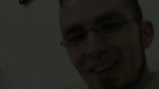 Twink wears sexy glasses while jerking off his thick cock
