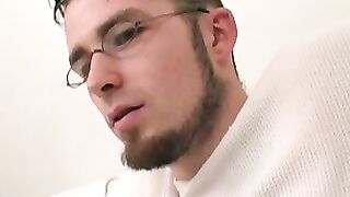 Twink wears sexy glasses while jerking off his thick cock