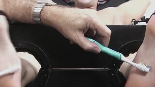 Restrained hunk laughs while tickle tormented by his dom