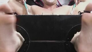 Restrained hunk laughs while tickle tormented by his dom