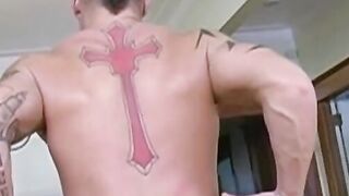 Tattooed muscular stud jerks off solo after an interview