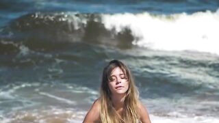 Sexy and hot babe Natalie E bounces her big boobs and tasty ass on the beach