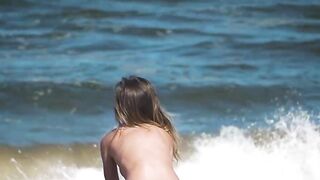 Sexy and hot babe Natalie E bounces her big boobs and tasty ass on the beach