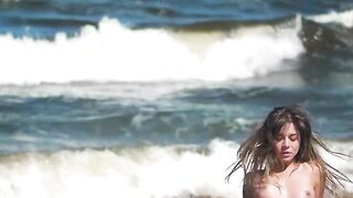 Sexy and hot babe Natalie E bounces her big boobs and tasty ass on the beach