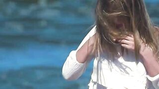 Sexy and hot babe Natalie E bounces her big boobs and tasty ass on the beach