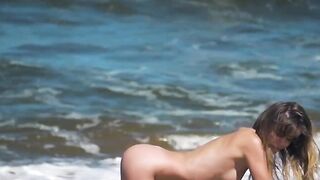 Sexy and hot babe Natalie E bounces her big boobs and tasty ass on the beach