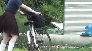 Japanese teen schoolgirl rubs her pussy over her panties
