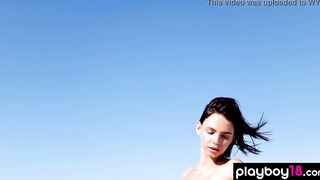 Slender all natural nude Hottie Ariel liking the sunshine at the beach